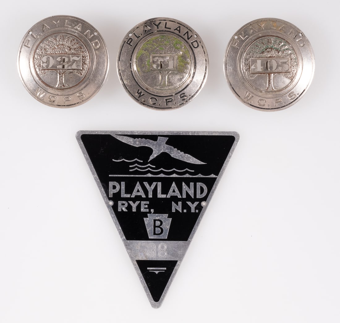 3 PLAYLAND AMUSEMENT PARK NEW YORK EMPLOYEE BADGES: Three Playland amusement park employee badges, each a West Chester Park Service badge, each missing most of the green coloring around the tree. 2 inches diameter. Also includes a Playland Rye, New Yor