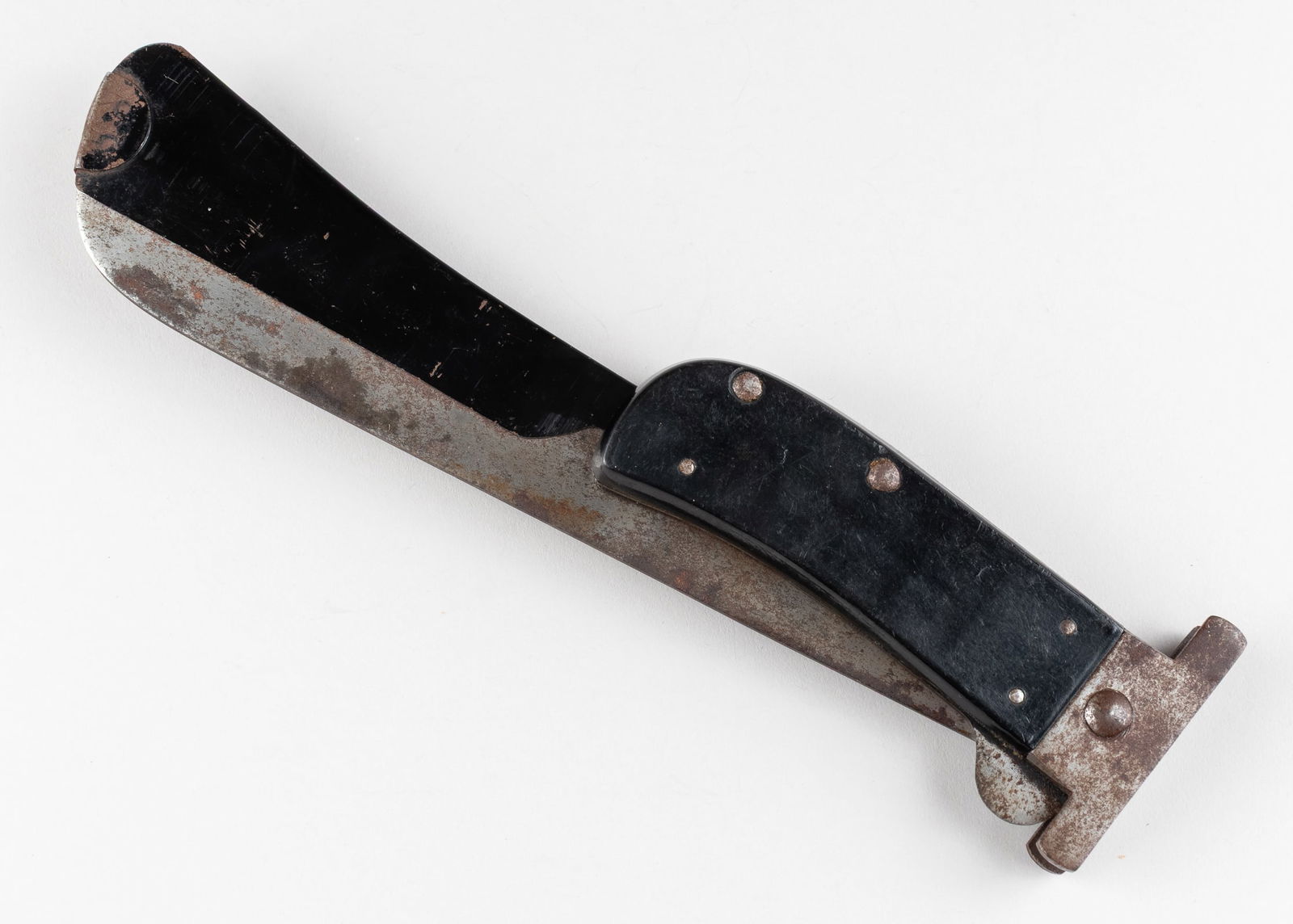 WWII USAAF SURVIVAL FOLDING MACHETE CAMILLUS: WWII USAAF emergency folding survival machete, with protective sheath covering for the blade, marked on the blade 'Camillus,' for Camillus Cutlery Company. Oxidation and scratching throughout the blad