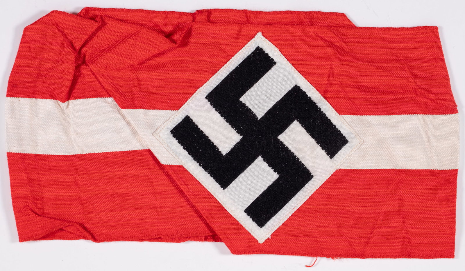 WWII CAPTURED HITLER YOUTH ARMBAND FROM THE ESTATE OF DOROTHY LAMOUR: WWII German Hitler Youth armband from the estate of American actress and singer Dorothy Lamour (1914-1996), a popular pin-up girl with American GIs during WWII. The armband has remnants of the RZM tag