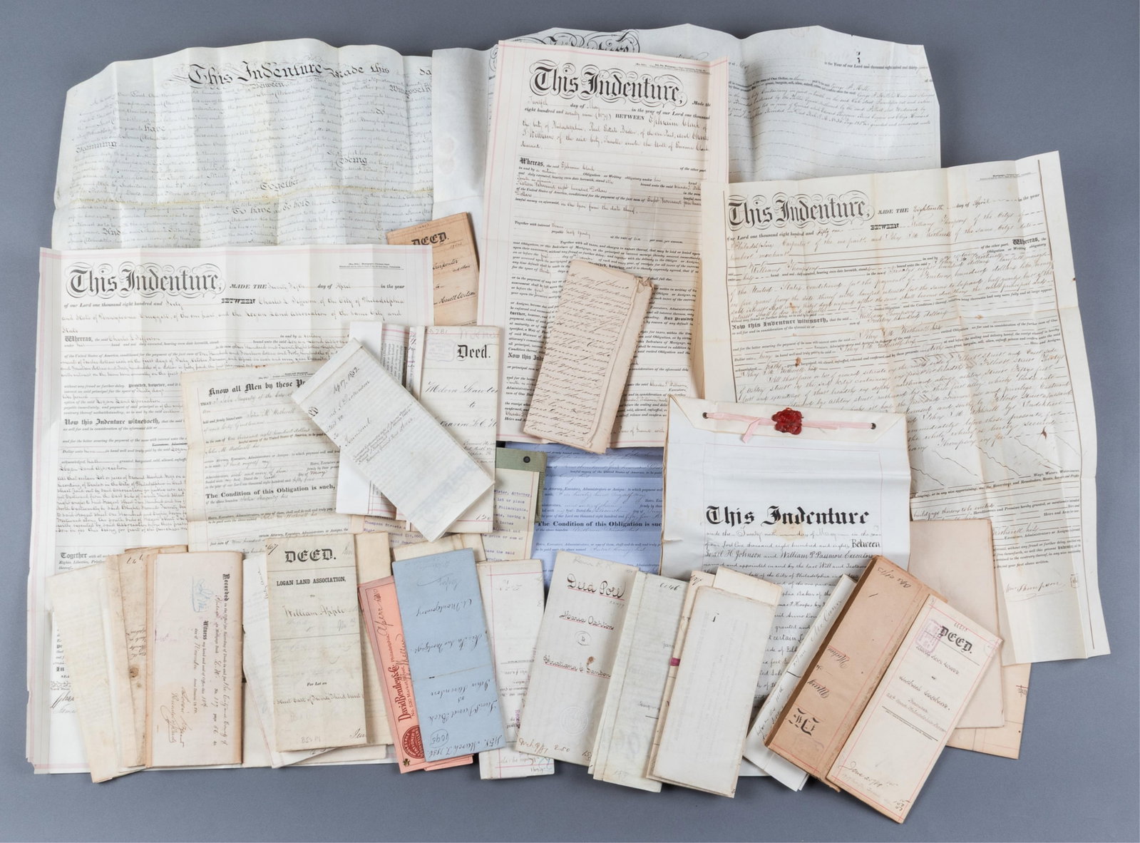 37 ANTIQUE INDENTURES AND DEEDS EARLY PHILADELPIA, PA AND BEYOND: Thirty-seven antique indentures and deeds, mostly relating to Philadelphia, 19th century. Including deeds for Quakers families. Folds, various sizes.
