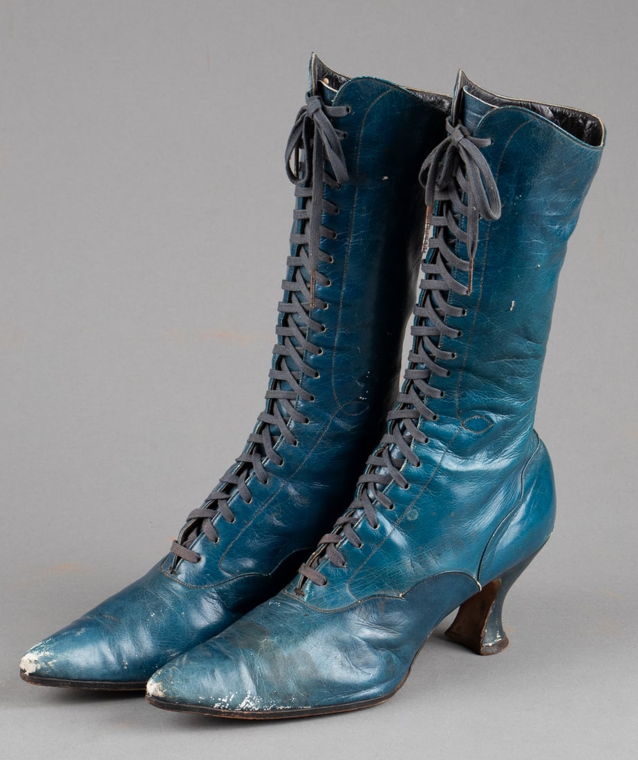 BLUE LEATHER VICTORIAN LACE-UP BOOTS: Blue leather Victorian lace-up women's boots, one of the shoes measures 13 x 10.5 x 3 inches.