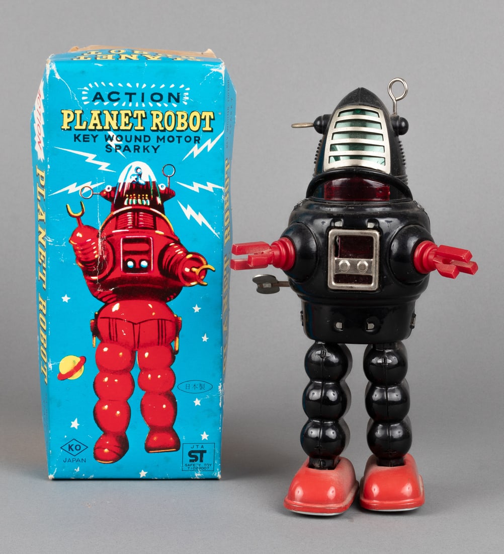 VINTAGE ACTION PLANET ROBOT WIND-UP TOY [KO JAPAN]: Vintage 'Action Planet Robot - Key Wound Motor Sparky,' made by Yoshiya KO toys, Japan. Black and red plastic, wind-up key included, sparking and wind-up mechanism in working order. 9.5 inches tall. A