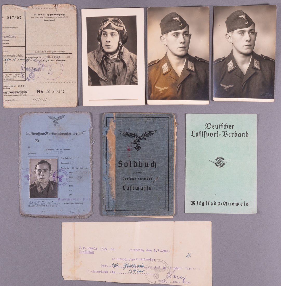 WWII GERMAN LUFTWAFFE SOLDBUCH, ID, AND PHOTOS: WWII German Luftwaffe Soldbuch, ID, and Photos, including a Soldbuch for Obergefreiter Helmut Gugel, with wounded information of Gugel like having bronchitus in August 1943, being wounded by shrapnel 
