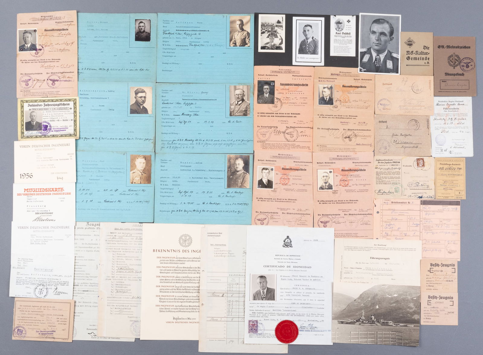 THIRD REICH WEHRMACHT DOCUMENT GROUPING: German Third Reich Wehrmacht document grouping, containing a misc. mix of IDs, official documents with Third Reich handstamps, death cards, and postcards. Sixteen pieces for Kriegsmarine Lt. Commander