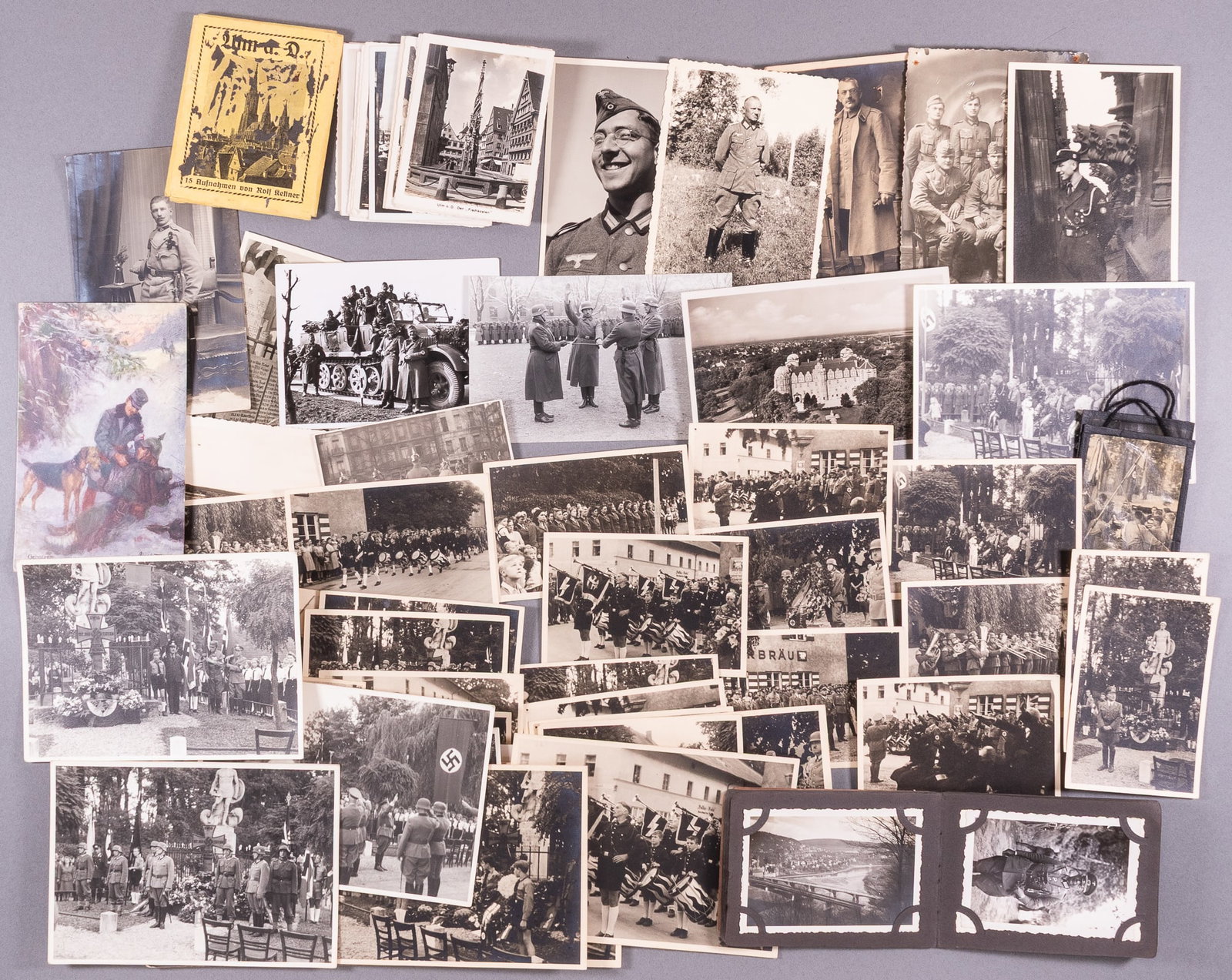 86 WWII GERMAN PHOTOGRAPHS: Eighty-six WWII German b/w photographs, including a personal photo album from a Wehrmacht soldier, with a photo of a German officer in full uniform, photos of a funeral, a Hitler youth parade, some WW