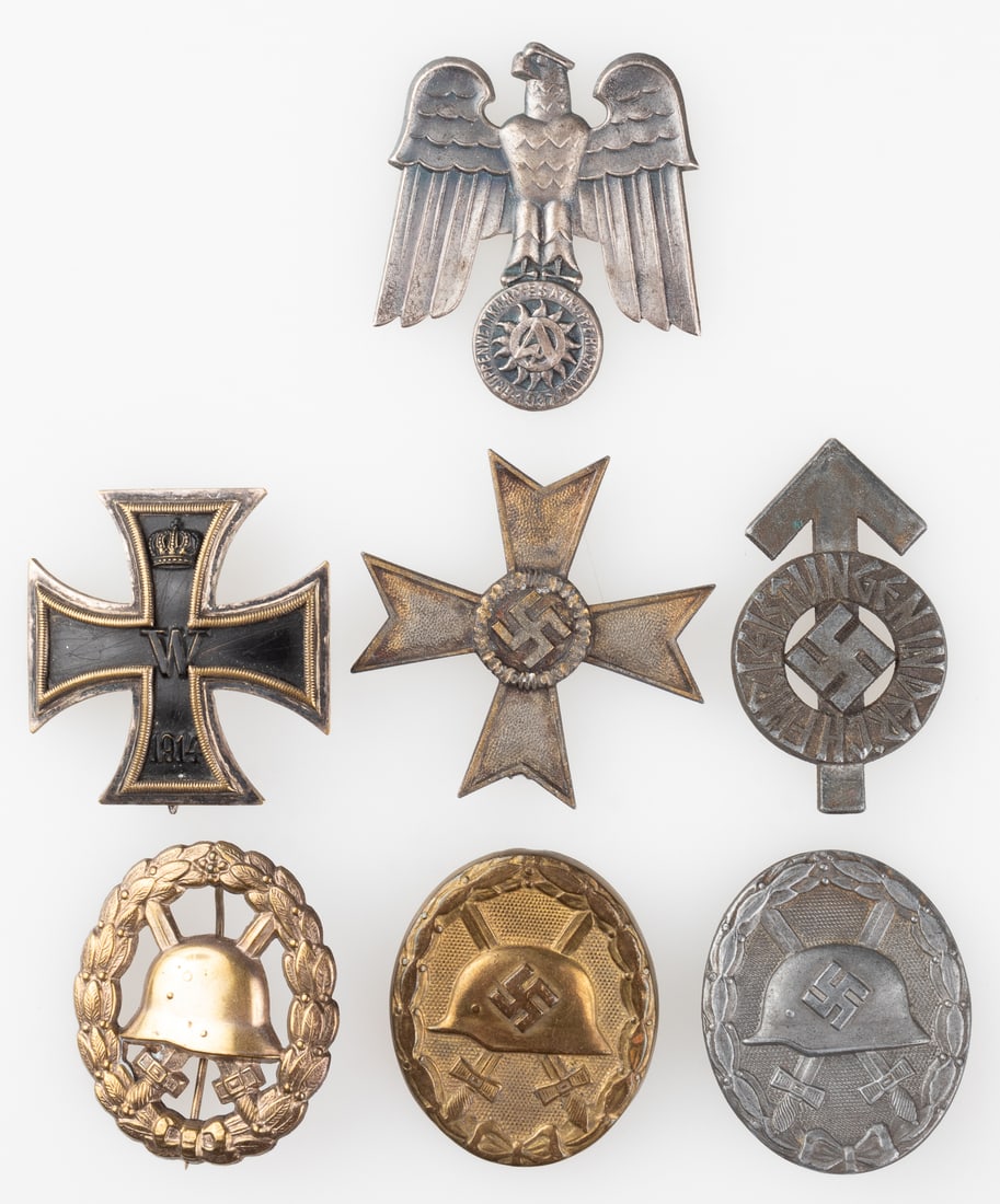 7 WWI & WWII GERMAN MEDALS W/ CASE: Seven WWI and WWII German medals with a WWI Iron Cross multi-medal case, including a WWI Iron Cross 2nd Class unmarked, a WWI Wound Badge in gold unmarked, a WWII Wound Badge in silver, marked on the 