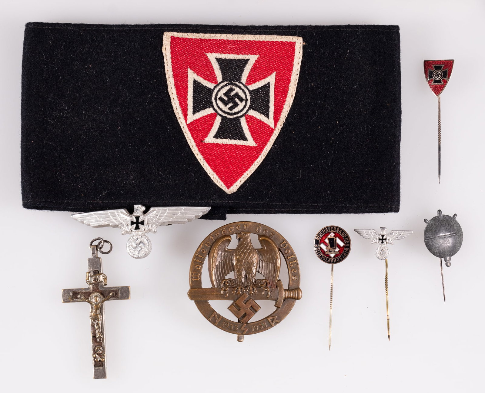 8 GERMAN VETERANS BADGES AND INSIGNIA: Eight German Kyffhauserbund (Veterans organization) insignia and badges, including a veteran membership armband, a veterans cap badge, two veteran stick pins, a Reichsverband stick pin, an Austrian NS
