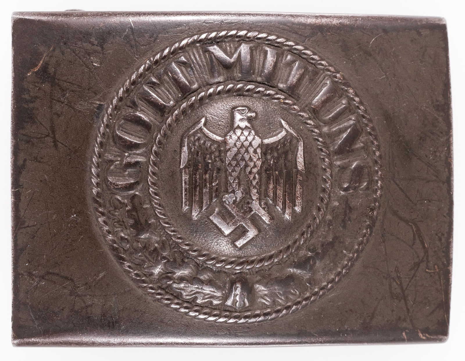 WWII GERMAN HEER BELT BUCKLE [E. SCHNEIDER LUDENSCHEID]: WWII German Heer enlisted mans belt buckle, marked on the reverse 'E.S.L. 43' for maker Ernst Schneider of Ludenscheid, green color steel belt buckle. 1 7/8 x 2.5 inches.