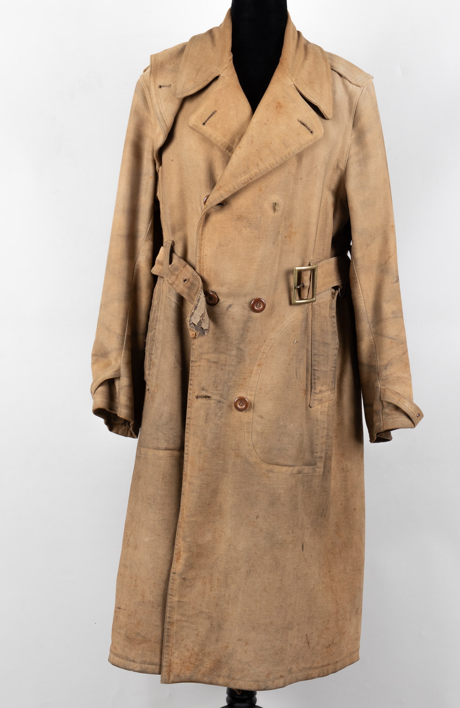 WWI BRITISH OVERCOAT: WWI British overcoat, no label inside the jacket, minor tearing to the fabric on the inside of the coat and to the outer belt.