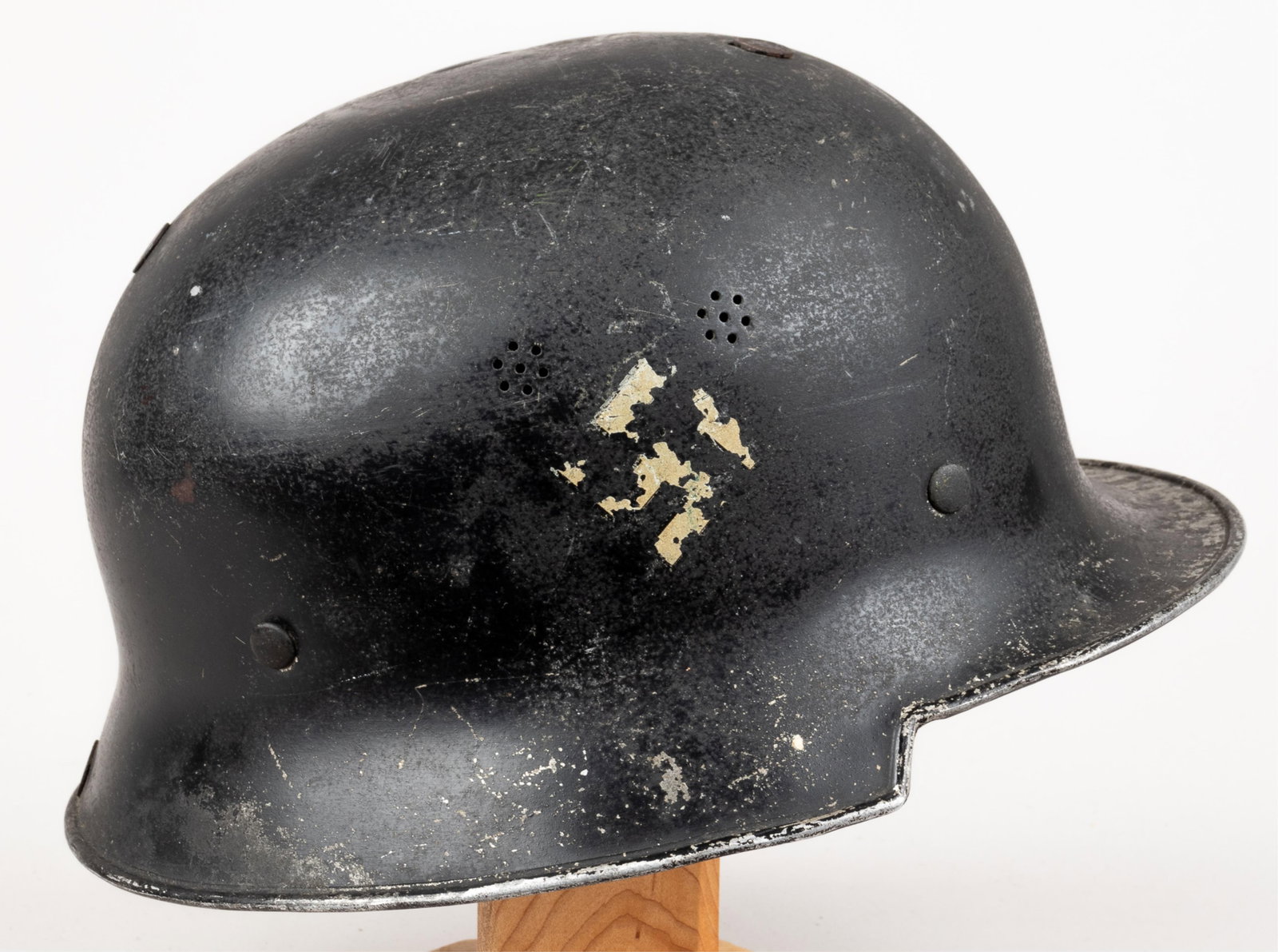 WWII GERMAN DOUBLE DECAL M34 FIRE BRIGADE HELMET [FEUERSCHUTZ POLIZEI]: German WWII double decal M34 fire brigade / Feuerschutz Polizei helmet. Includes the German colors shield decal on the left, and a white swastika decal on the right side. Unmarked. Leather helmet line