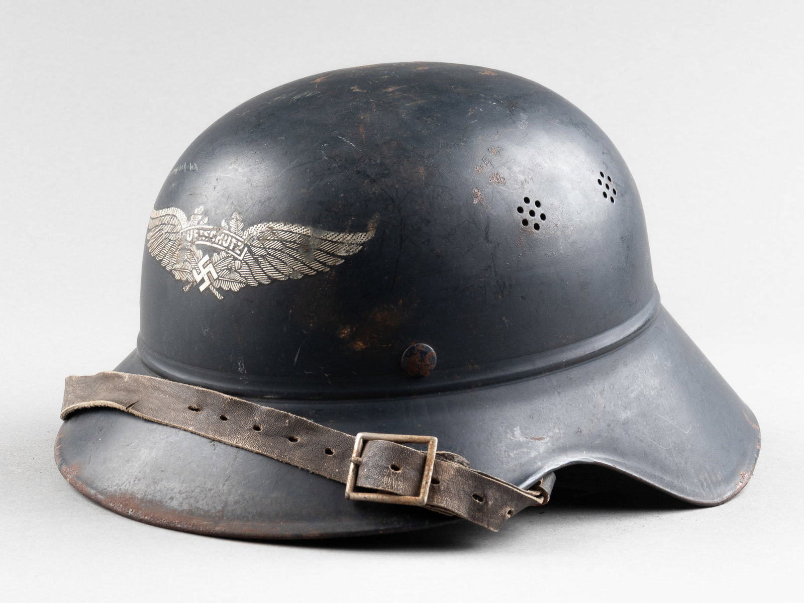 GERMAN AIR RAID PROTECTION LUFTSCHUTZ HELMET: WWII German Luftschutz civil defense gladiator 3 piece helmet, with Luftschutz insignia on the front of the helmet, Luftschutz decal misaligned to the right which is typical for the late war gladiator