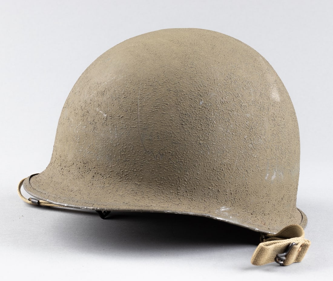 WWII AMERICAN M1 HELMET WITH W/ ST. CLAIR LINER FIXED BALE FRONT SEAM: WWII American M1 helmet with liner, fixed bale, front seam, no visible maker marks on the helmet shell, intact low-pressure liner with leather strap covers, marked on the inside of the liner 'SC' in y