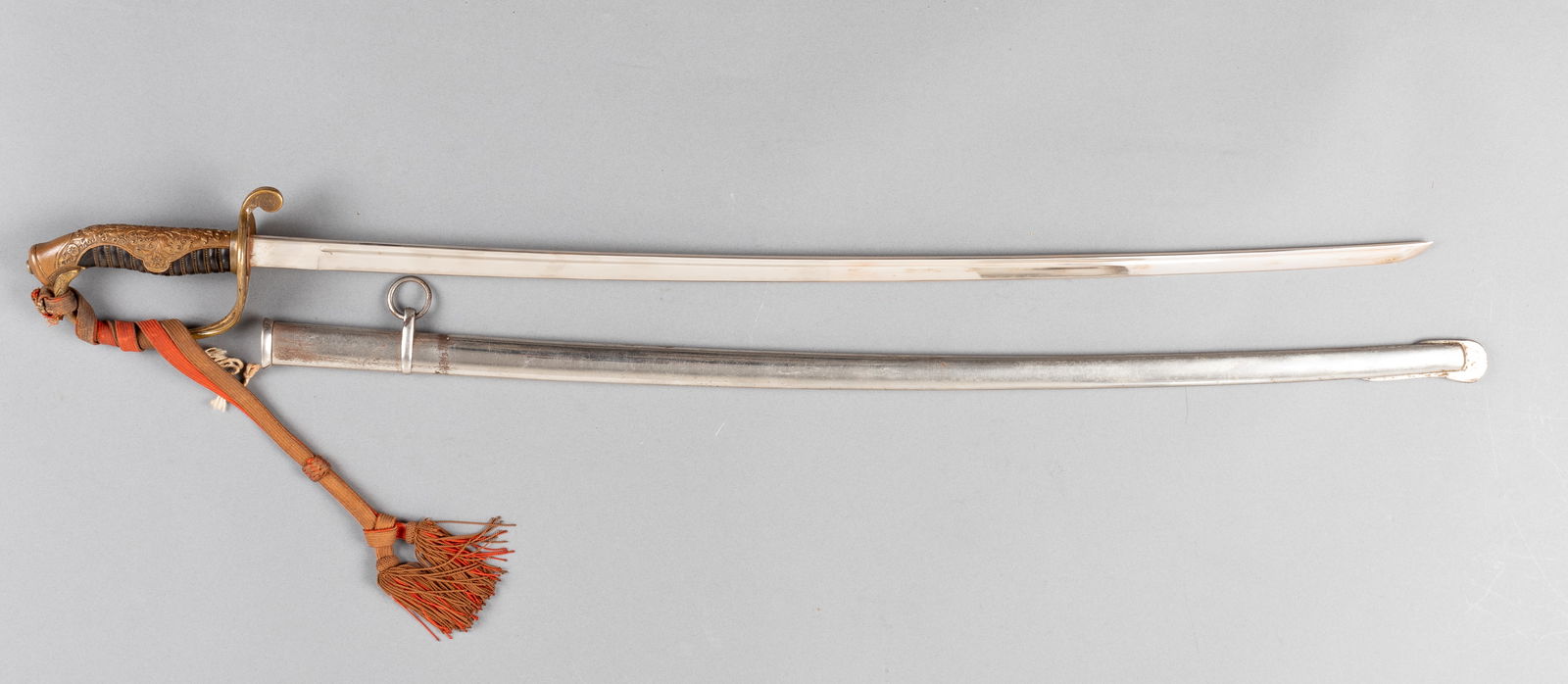 IMPERIAL JAPANESE TYPE 19 KYU-GUNTO OFFICERS SWORD: Imperial Japanese Type 19 'Kyu-Gunto' [Old Army] officers parade sword, with a brass decorative hand guard and samurai style blade, 27.25 inch blade, 32.5 inches total, 28.5 inch long scabbard. Attach