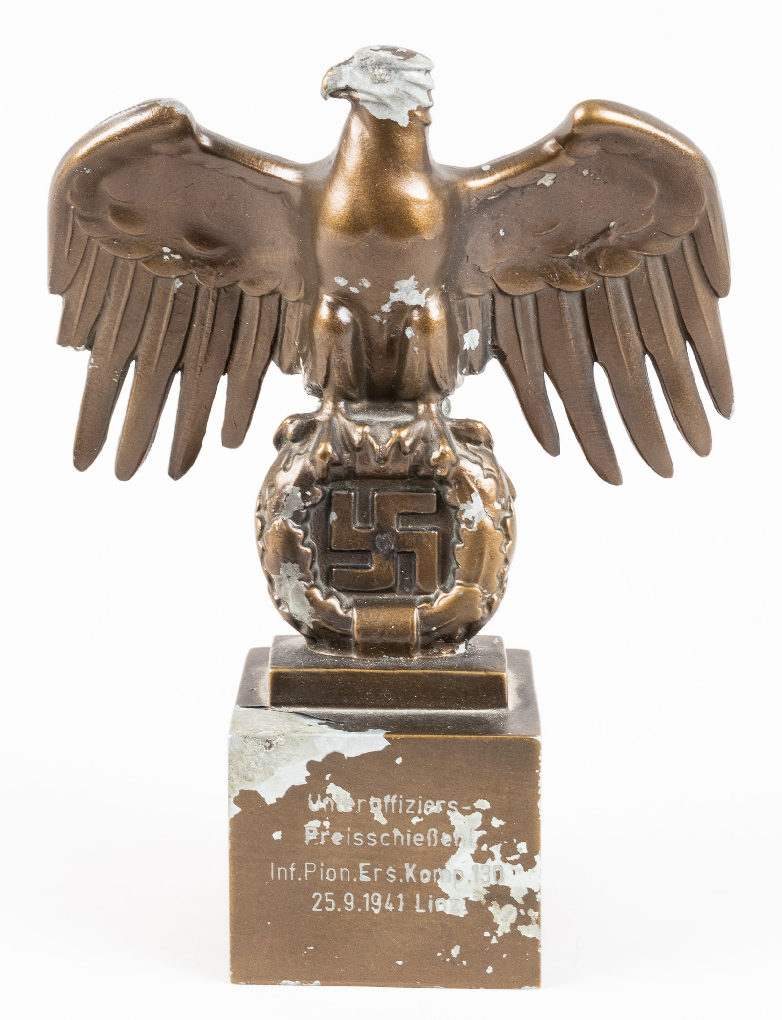 GERMAN REICHSADLER EAGLE TABLE DISPLAY: German Reichsadler eagle table display. Features a German Reichsadler eagle clutching a wreath with a swastika in the center. On the reverse of the wreath bears the maker mark 'H5 RZM M3/28' for maker