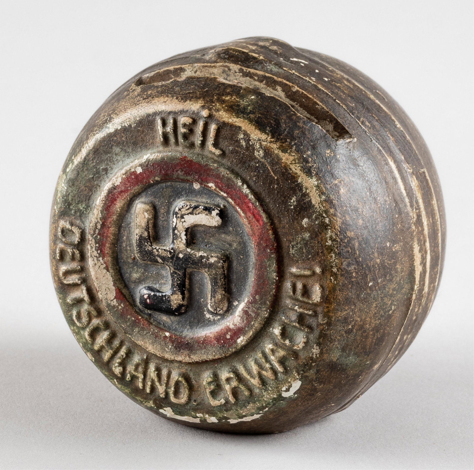 GERMAN THIRD REICH PROPAGANDA COIN BANK: German Third Reich propaganda donation coin bank, one side bears a swastika in the center, reads 'Heil Deutschland Erwache!' The opposite side shows a Reichseagle in the center and reads 'Freiheit u. 