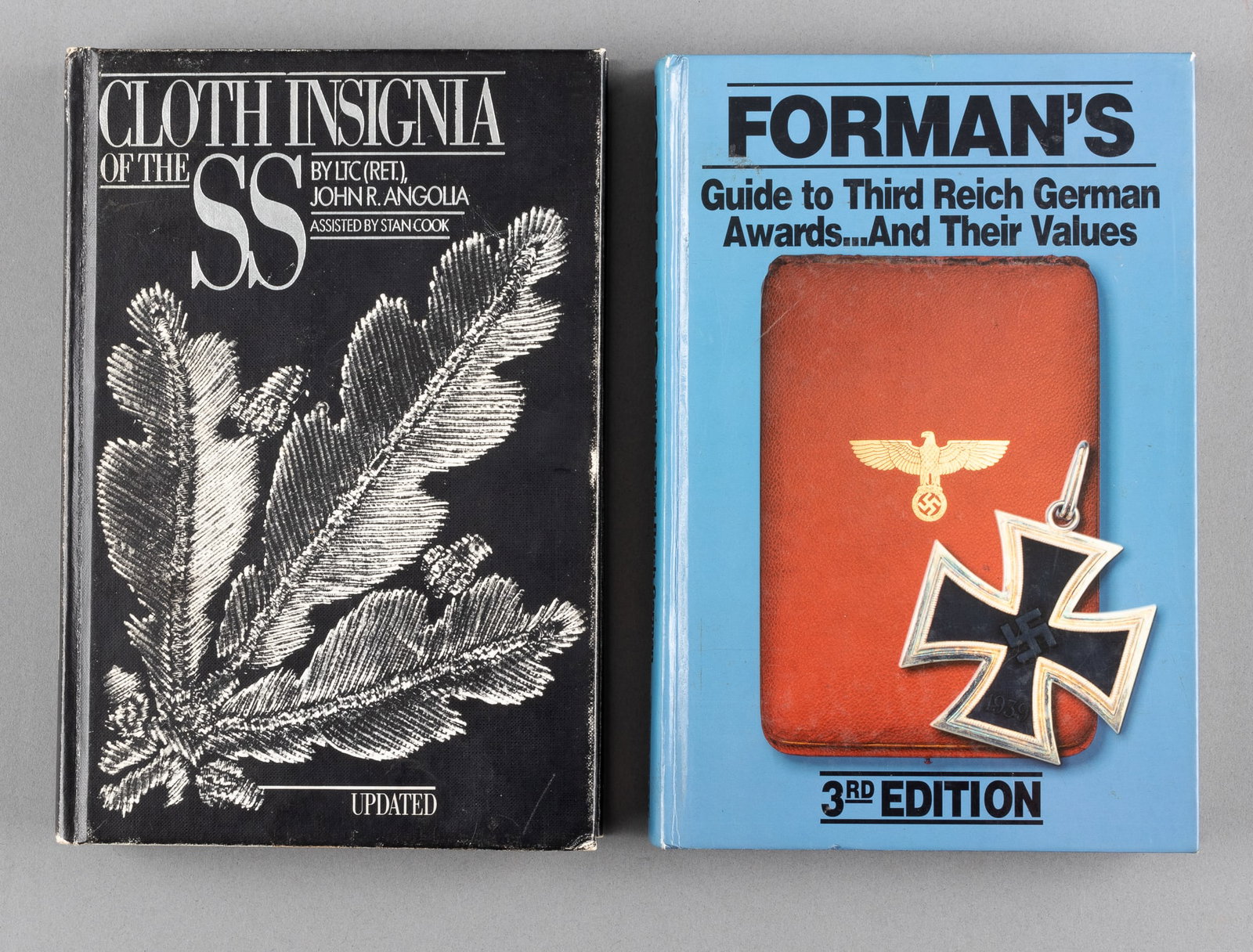 2 GERMAN THIRD REICH INSIGNIA AND MEDAL REFERENCE BOOKS: Two German Third Reich insignia and medal reference books written in English, including 'Cloth Insignia of the SS' by Ltc. John R. Angolia assisted by Stan Cook,1983 second edition, hard cover, 496 pa