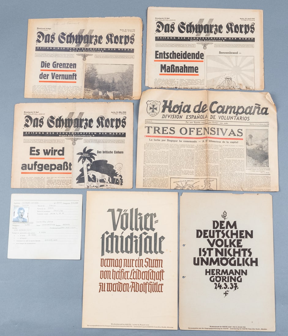 WAFFEN SS NEWSPAPERS AND EPHEMERA: Waffen SS newspapers and ephemera, including three issues of Das Schwarze Korps, two dated 1942 and one dated 1944, two Wochenspruch propaganda broadsides, one dated 1939 and one dated 1940, along wit
