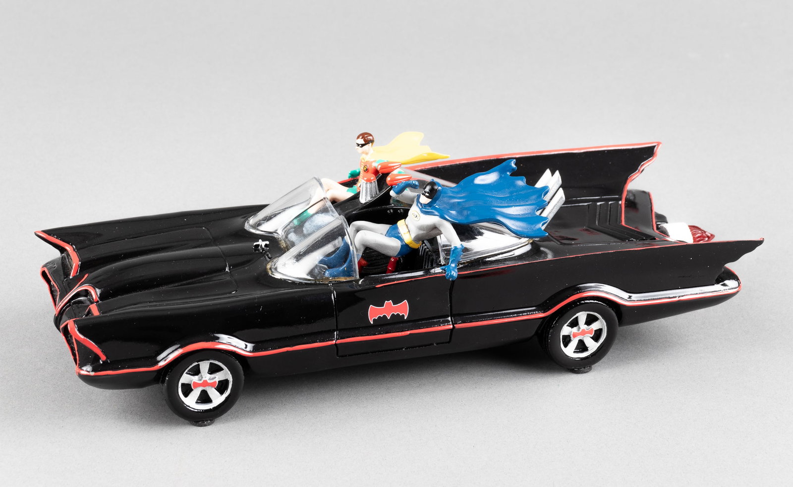 BATMOBILE BRADFORD EXCHANGE COLLECTIBLE STATUE: Batmobile collectible statue from the Bradford Exchange, lights up and plays the Batman TV show theme song when turned on. Hand-painted statue of Batman and Robin leaping from the Batmobile, front lig