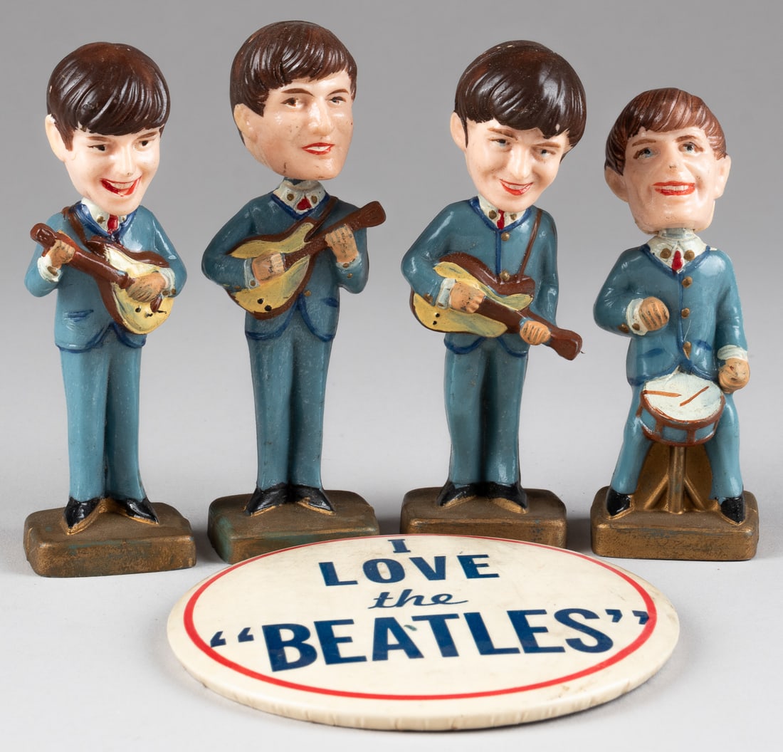 1960S BEATLES BOBBLEHEAD CAKE TOPPERS: Four 1960s Beatles bobblehead cake toppers of John, Paul, Ringo, and George. Each marked 'Made in Hong Kong' on the bottom of the toppers, approx. 4 inches tall each. WITH 'I Love The Beatles' button,