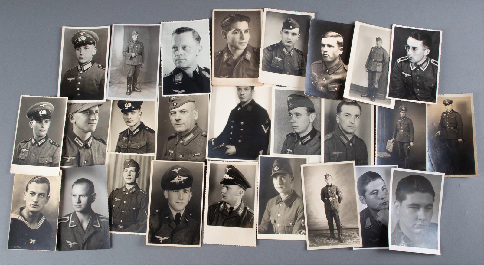 26 WWII GERMAN SOLDIER PORTRAITS: Twenty-six WWII b/w German soldier portrait prints. Includes Heer, Kriegsmarine, Luftwaffe, and RAD members, some postcard photos with writing on the reverse. Approx. 4 x 6 inches each.