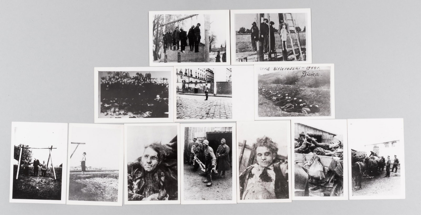 12 PHOTOGRAPHS OF HOLOCAUST NAZI ATROCITIES: Twelve b/w photographs of Jewish prisoners in Poland killed by depicting executed victims lying near mass graves, public hangings, and dead bodies. The photographs originate from an archive in Poland 