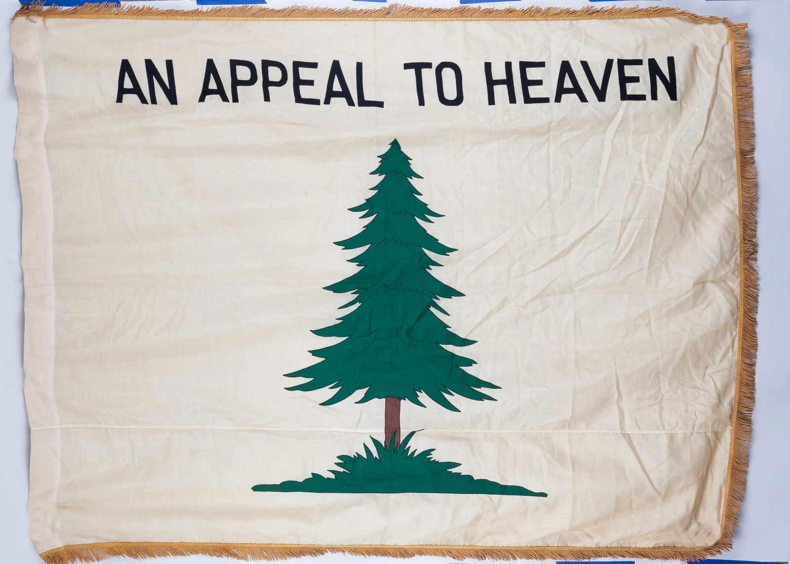 8 AMERICAN AND BRITISH FLAGS: Eight American and British flags, including a Union Jack flag with gold fringe, the flag of England with Saint George's Cross, a Continental Union Flag, the 'An Appeal to Heaven' American Revolutionar