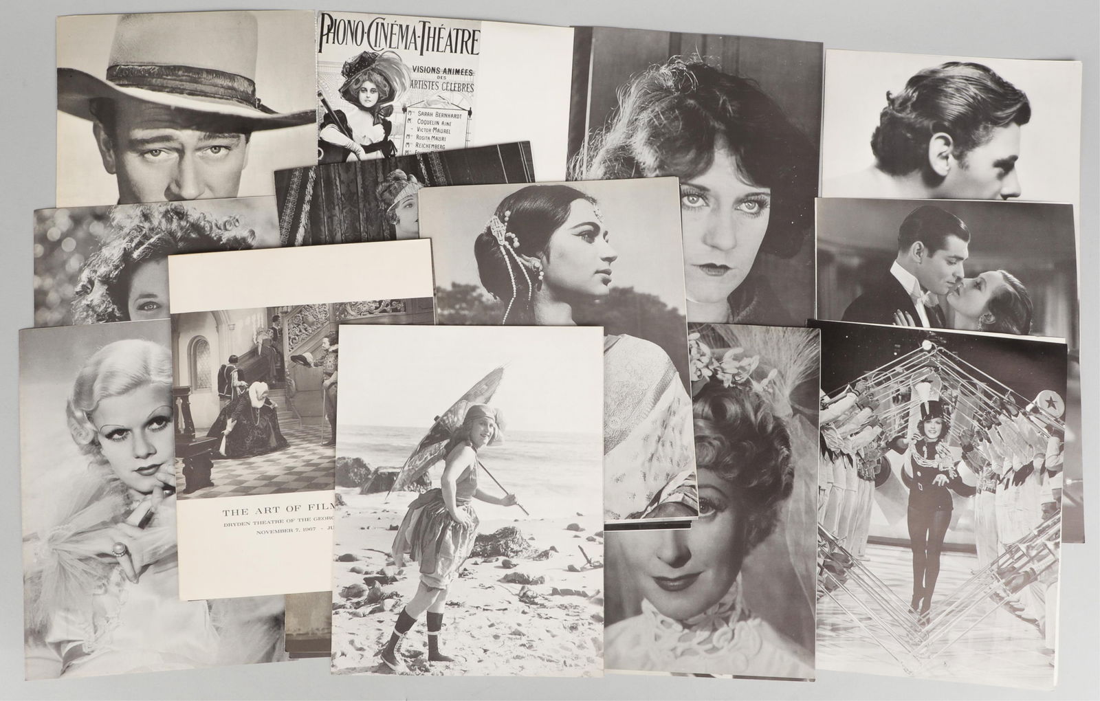 VINTAGE MOVIE POSTERS, PHOTOS, AND BOOKS [160+ PIECES]: Vintage movie ephemera, over 160 pieces, including posters, still frame photographs, movie cards, movie review books, theater playbills, and promotional material. Features: Nine negatives with matchin