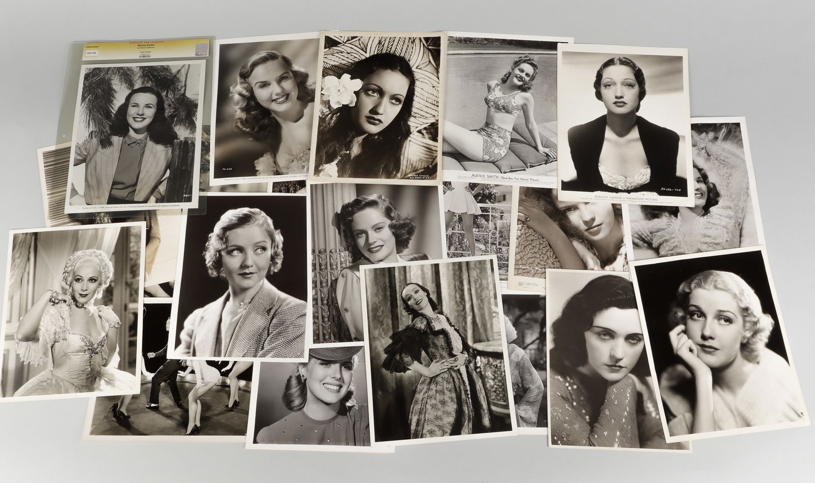 21 HOLLYWOOD GOLDEN AGE ACTRESS PROMO PHOTOS: Collection of twenty-one Hollywood golden age actress movie stills and promotional photos, including photos featuring Alexis Smith, Deanna Durbin, Dorothy Lamour, Anita Louise, Shirley Temple, Pola Ne