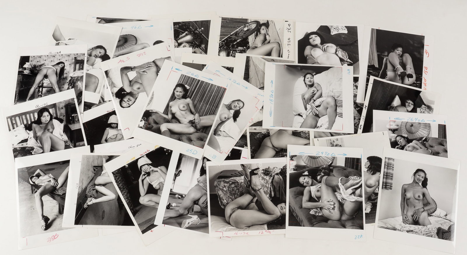 35 VINTAGE ADULT EROTIC PHOTOGRAPHS OF ASIAN NUDES: Thirty-five vintage adult erotic b/w photographs of nude Asian women created for magazine publication. Most with cropping marks. 8 x 10 inches.