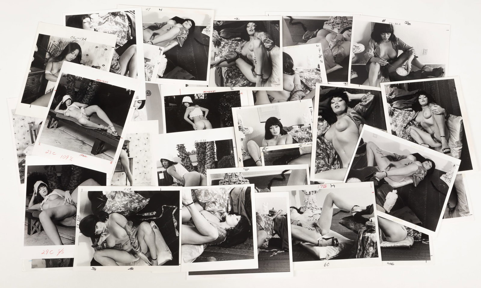 30 VINTAGE ADULT EROTIC PHOTOGRAPHS OF ASIAN NUDES: Thirty vintage adult erotic 8 x 10 inch b/w photographs of nude Asian women created for magazine publication. Most with cropping marks.