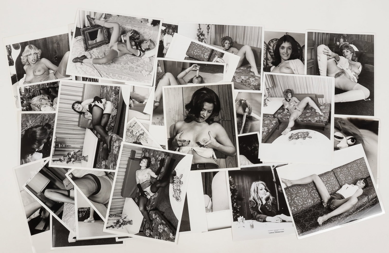 32 VINTAGE ADULT EROTIC PHOTOGRAPHS: Thirty-two vintage 8 x 10 inch b/w erotic photographs for magazine publication. Some with cropping marks and comments or mode names on verso.