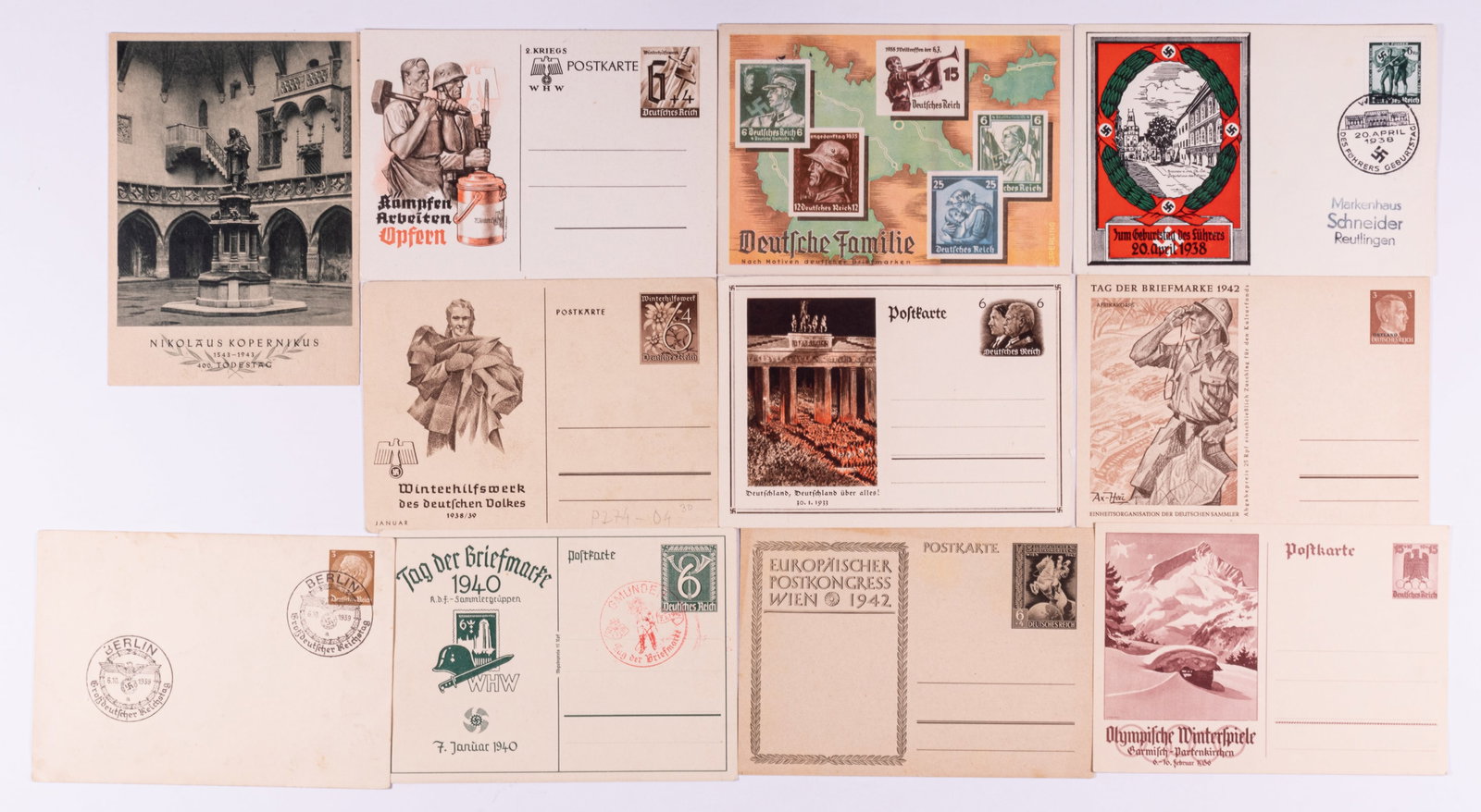 WWII GERMAN PATRIOTIC POSTCARDS (20): Twenty WWII German postcards, including an Olympia postcard, Winterhilfswerk postcards, a colonial card, and other German patriotic postcards, also include first-day cancellation stamps for the German