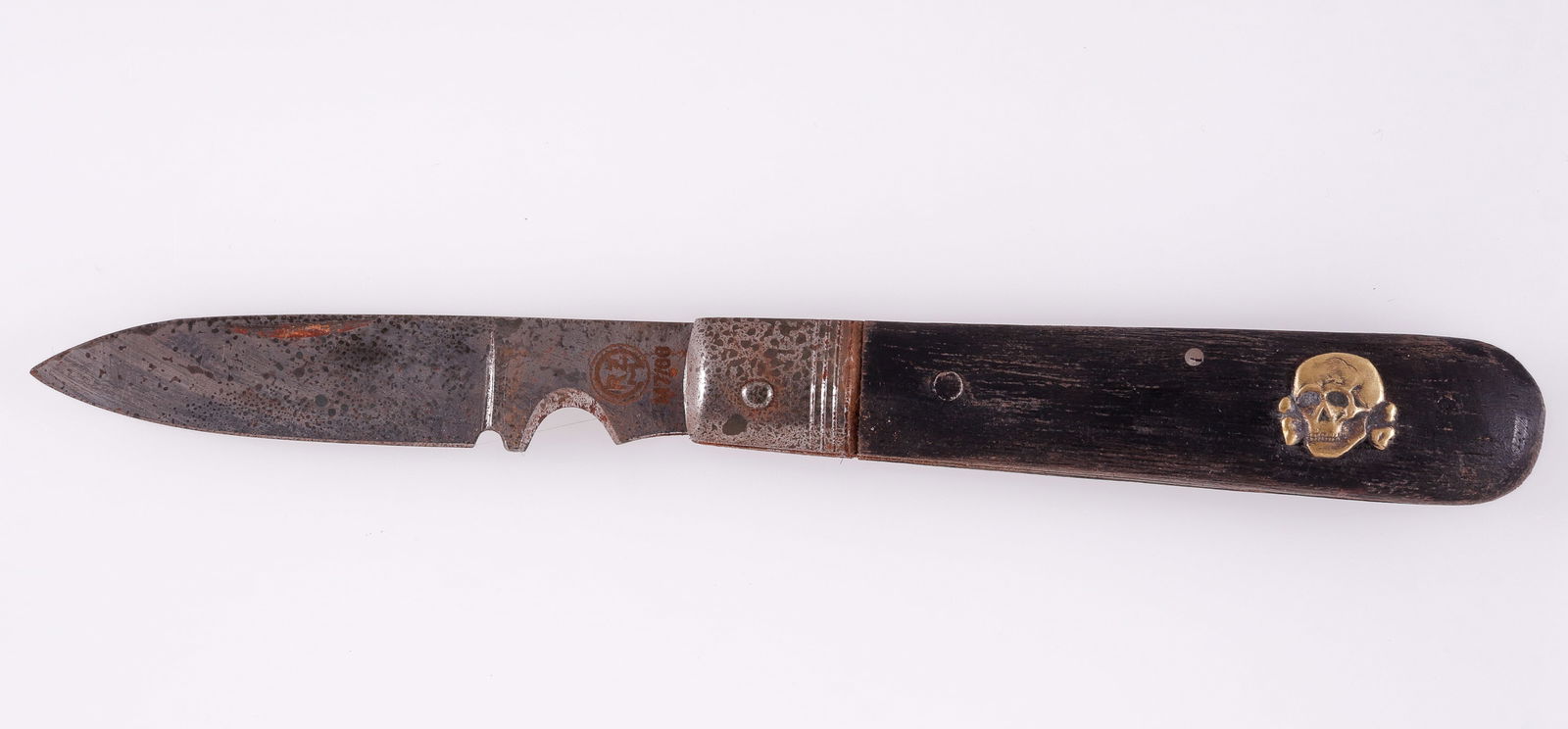 TOTENKOPF POCKET KNIFE: Totenkopf pocket knife, blade is marked on the ricasso 'Carl Eickhorn - Solingen' on one side, and 'RZM M7/66' on the reverse. 3.5-inch long blade, wood grips with gold colored Totenkopf insignia on o