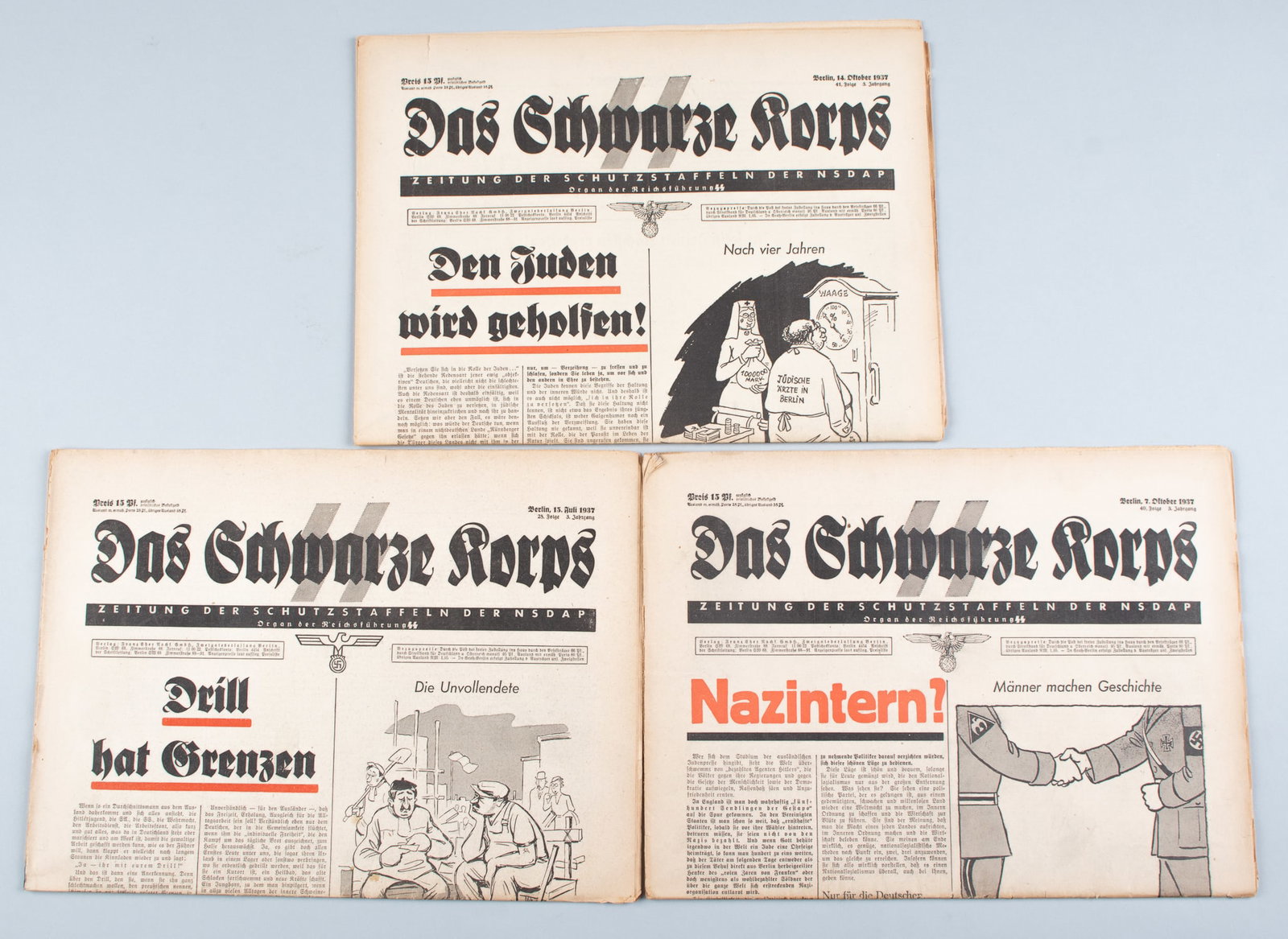 3 DAS SCHWARZE KORPS SS NEWSPAPERS: Three issues of the official SS newspaper 'Das Schwarze Korps,' including one from July 15, 1937, one from October 7, 1937, and one from October 14, 1937, with an antisemitic satirical cartoon on the 