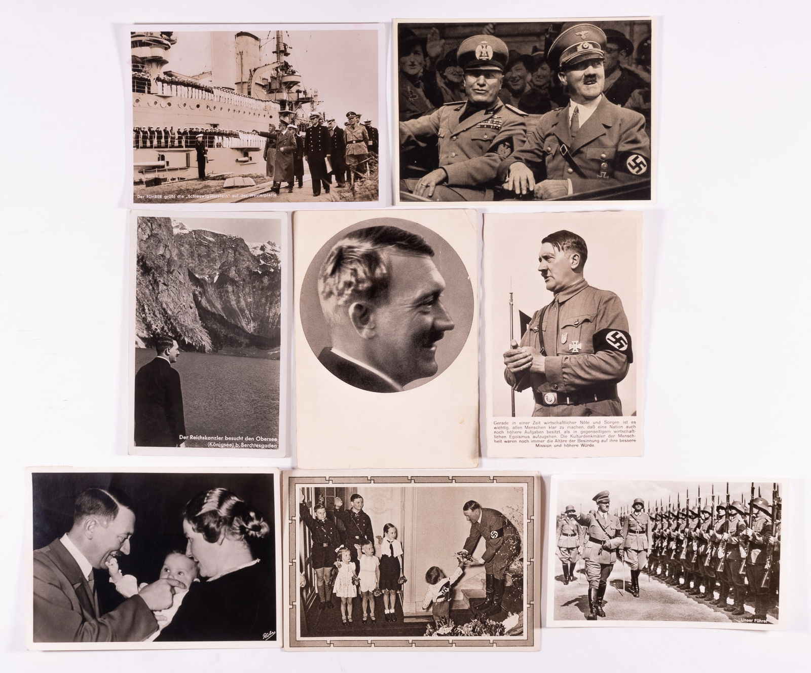 GROUP OF 28 ADOLF HITLER POSTCARDS: Lot of twenty-eight postcards and cigarette cards, including eight Adolf Hitler postcards, seven Adolf Hitler cigarette cards, and thirteen German military postcards and cigarette cards. In used condi
