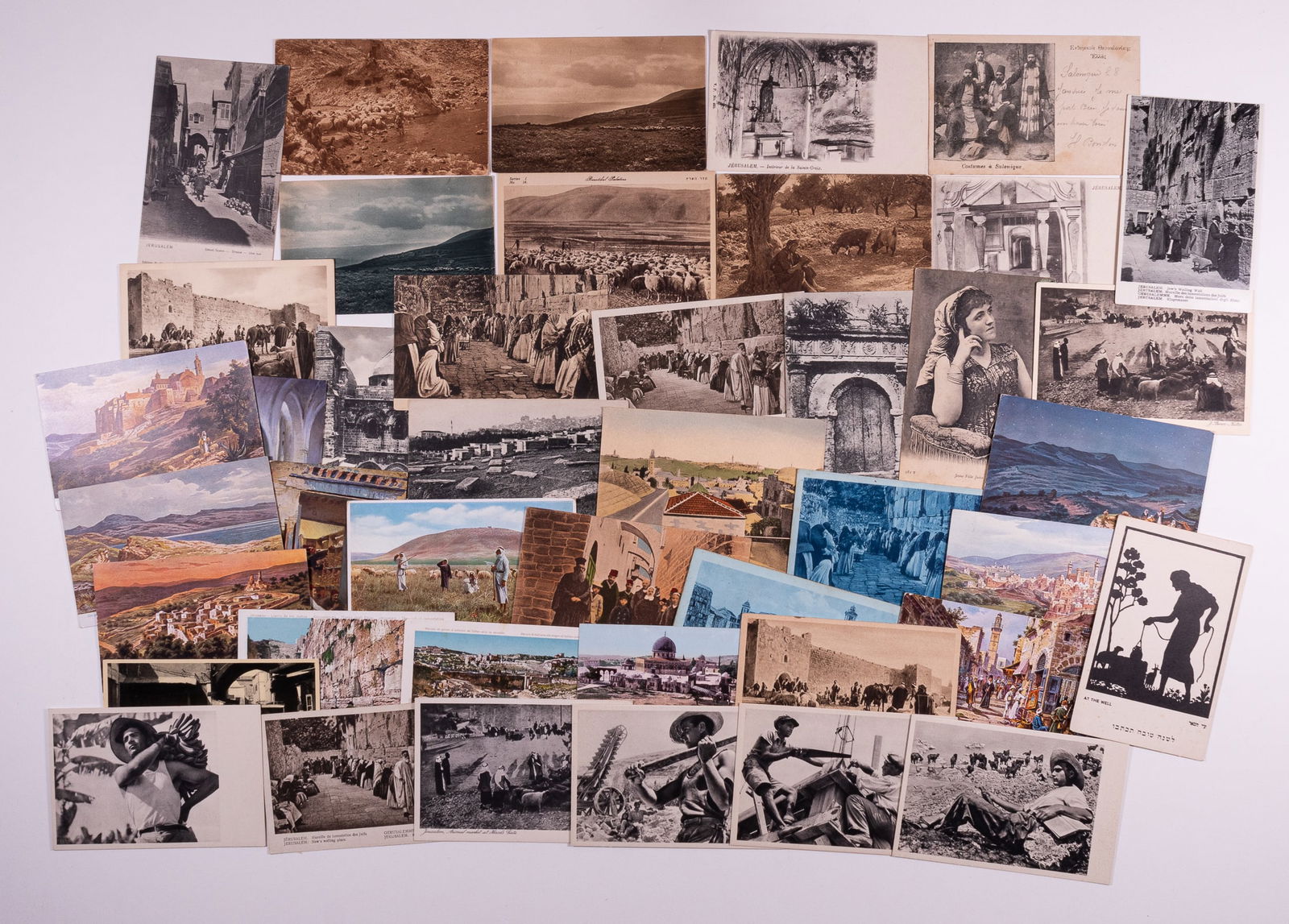 ISRAEL & PALESTINE POSTCARDS [JUDAICA]: Lot of 43 postcards mostly of Jerusalem, some of Palestine, Bethlehem, and a kibbutz. Some postally used and some unused, in color and black-and-white. Approx 3.5 x 5.5 inches.