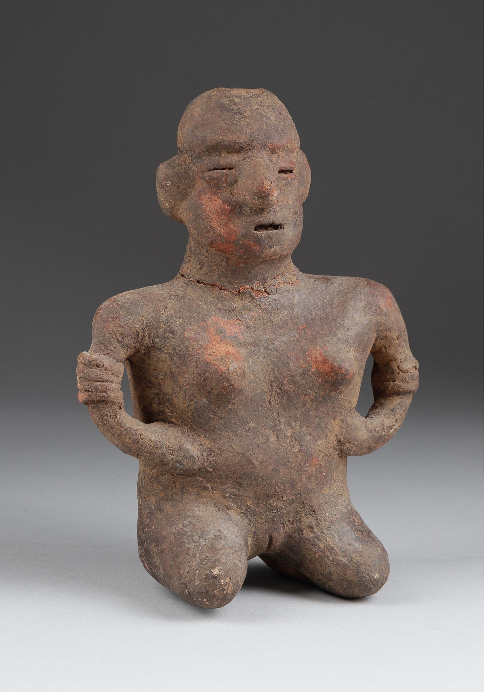 PRE-COLUMBIAN NAYARIT POTTERY STANDING FIGURE: Pre-Columbian Nayarit pottery of a standing figure, head with cracking around the neck that has been reattached. 8 x 5.5 x 2.75 inches. From the collection of G. Theofiles.