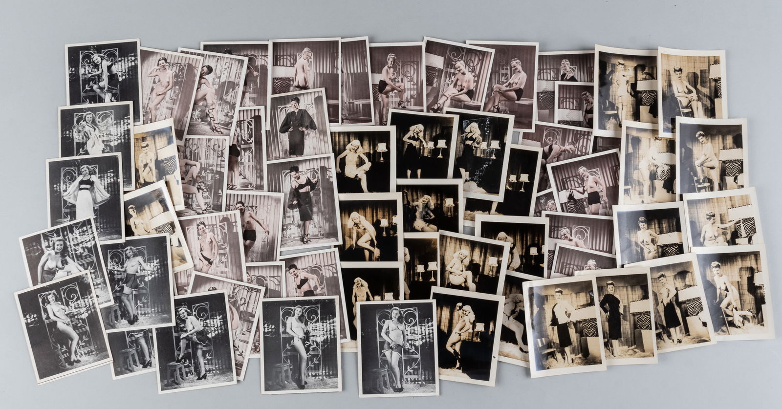58 VINTAGE NUDE PHOTOGRAPHS: Fifty-eight vintage nude photographs, including four photo sets, two with twelve photos, one with fourteen photos, one photo torn on the front, and one with fifteen photos. Photos between 3.25 x 5 inc