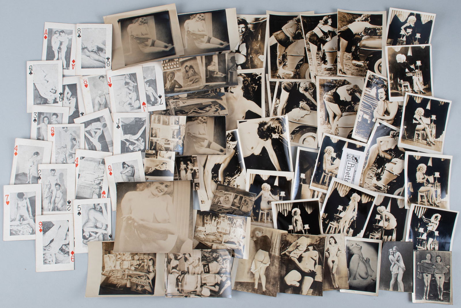 LARGE LOT OF EROTICA PHOTOS AND CARDS: Large lot of erotica photos and cards. Including eighteen playing cards, each with an erotic scene, and 40 photos. 58 total pieces.