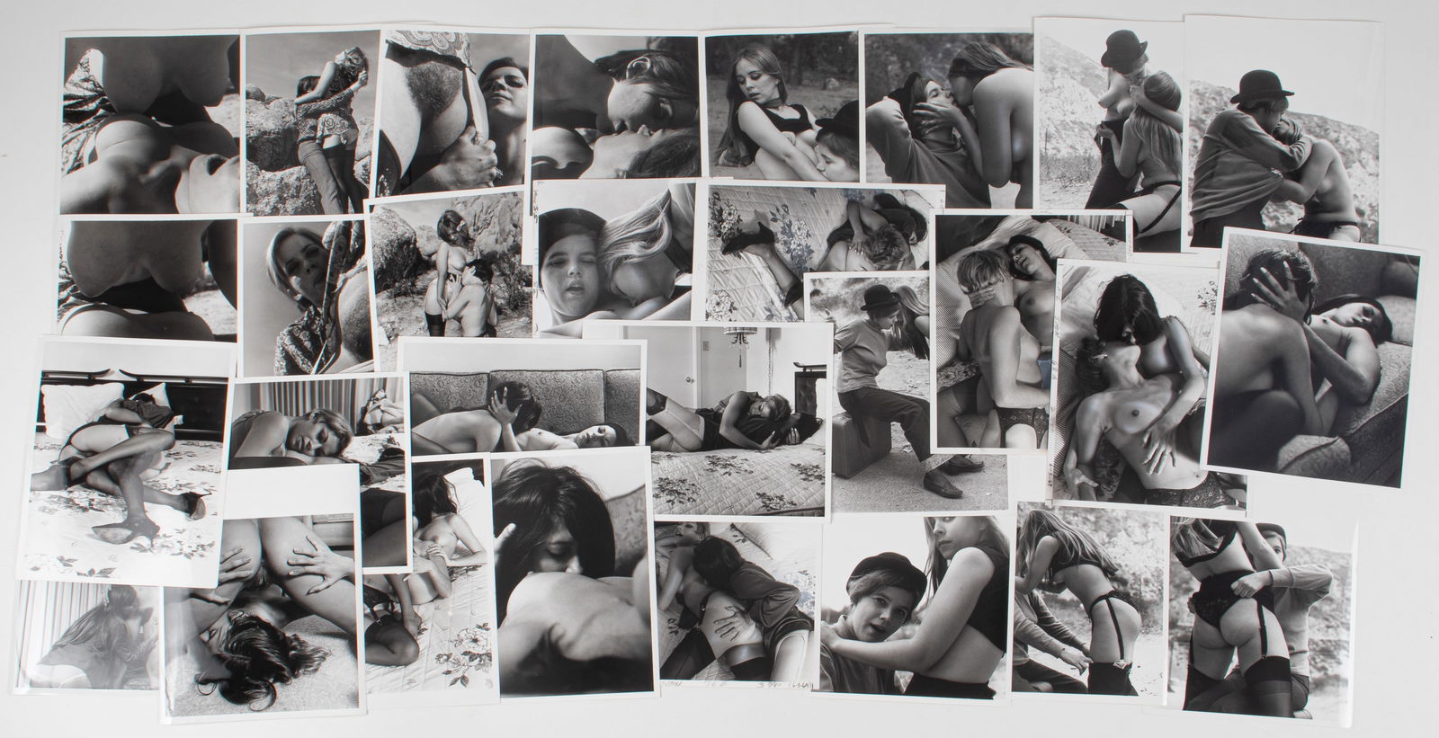 31 VINTAGE ADULT EROTIC LESBIAN PHOTOGRAPHS: Thirty-one vintage b/w adult lesbian erotic photographs, all from professional scenes, likely intended for magazine publishing, all with performer names on the reverse, some with crop marks and instru