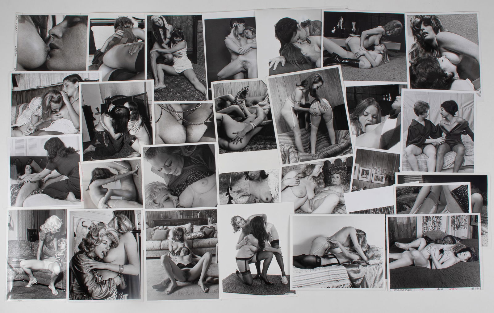 30 VINTAGE ADULT EROTIC LESBIAN PHOTOGRAPHS: Thirty vintage b/w adult lesbian erotic photographs, all from professional scenes, likely intended for magazine publishing, all with performer names on the reverse, six with crop marks and instruction