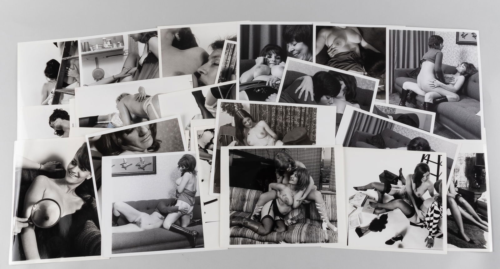 30 VINTAGE ADULT EROTIC LESBIAN PHOTOGRAPHS: Thirty vintage b/w adult lesbian erotic photographs, all from professional scenes, likely intended for magazine publishing, all with performer names on the reverse, one with crop marks and instruction