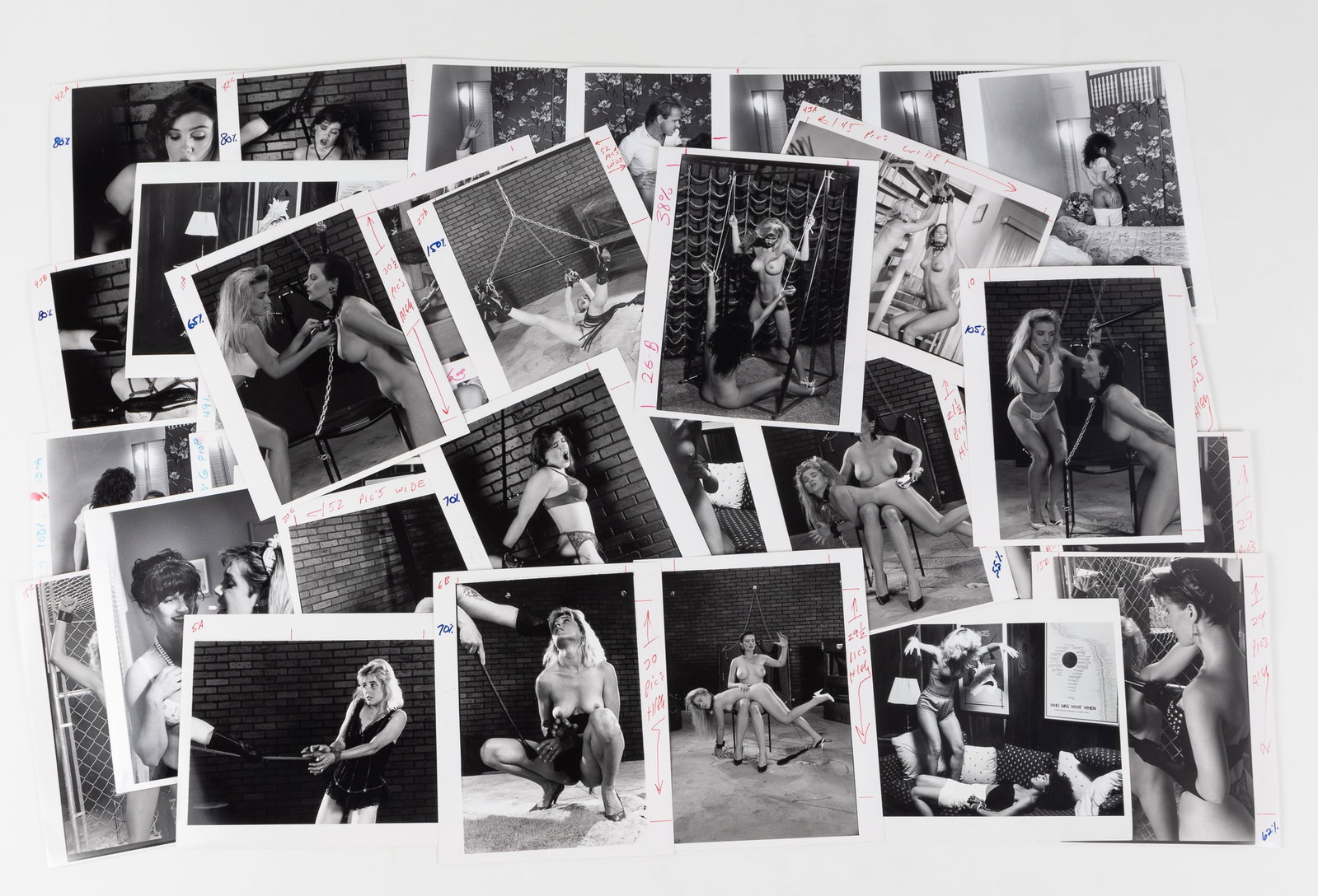 37 VINTAGE FETISH BONDAGE AND SPANKING PHOTOGRAPHS: Thirty-seven vintage b/w adult fetish bondage and spanking erotic photographs, likely intended for magazine publishing, most with crop markings and instructions on the margins, 8 x 10 inches each.