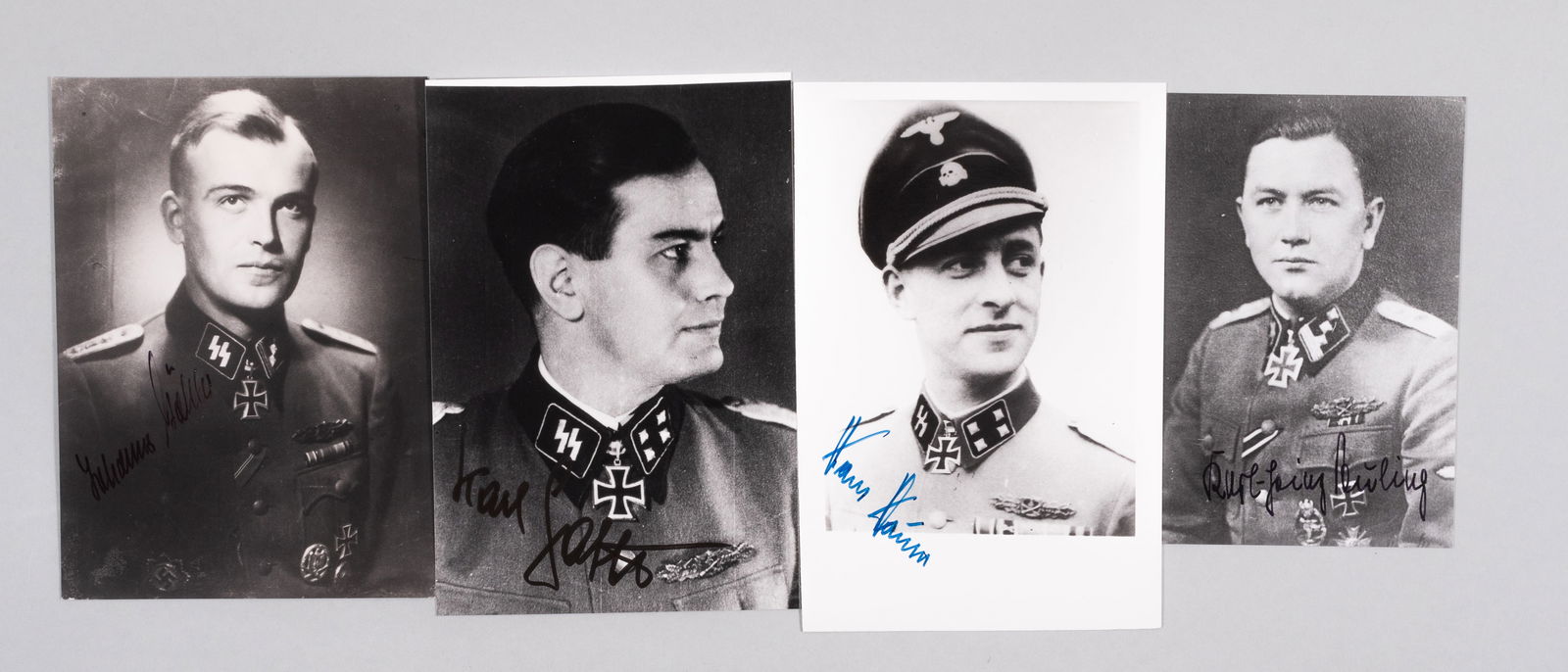 4 WWII WAFFEN SS KNIGHT'S CROSS RECIPIENTS: Four WWII Waffen SS German Knight's Cross recipient autographs, including one from HANS HAUSER (1916-2001), part of SS-Standarte 'Deutschland,' KARL-HEINZ EULING (1919-2014), part os 2. SS-Totenkopf-S