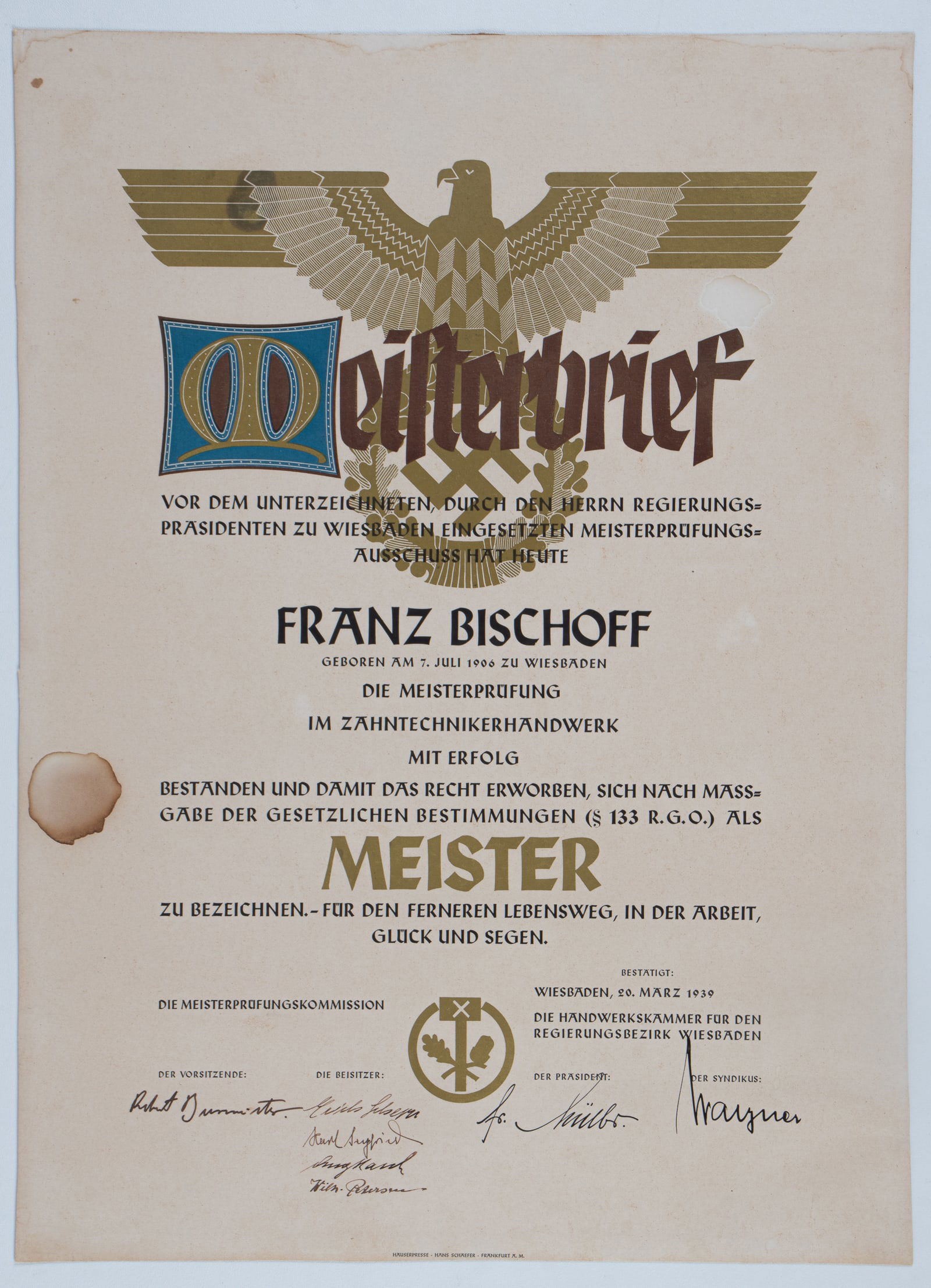 THIRD REICH GERMAN MEISTERBRIEF FOR A NAZI DENTIST: Third Reich German Meisterbrief for Nazi Dentist, awarded to Franz Bischoff upon completion of his Mastery classes, awarded in Wiesbaden, March 20th, 1939, by the Chamber of Commerce in Wiesbaden.