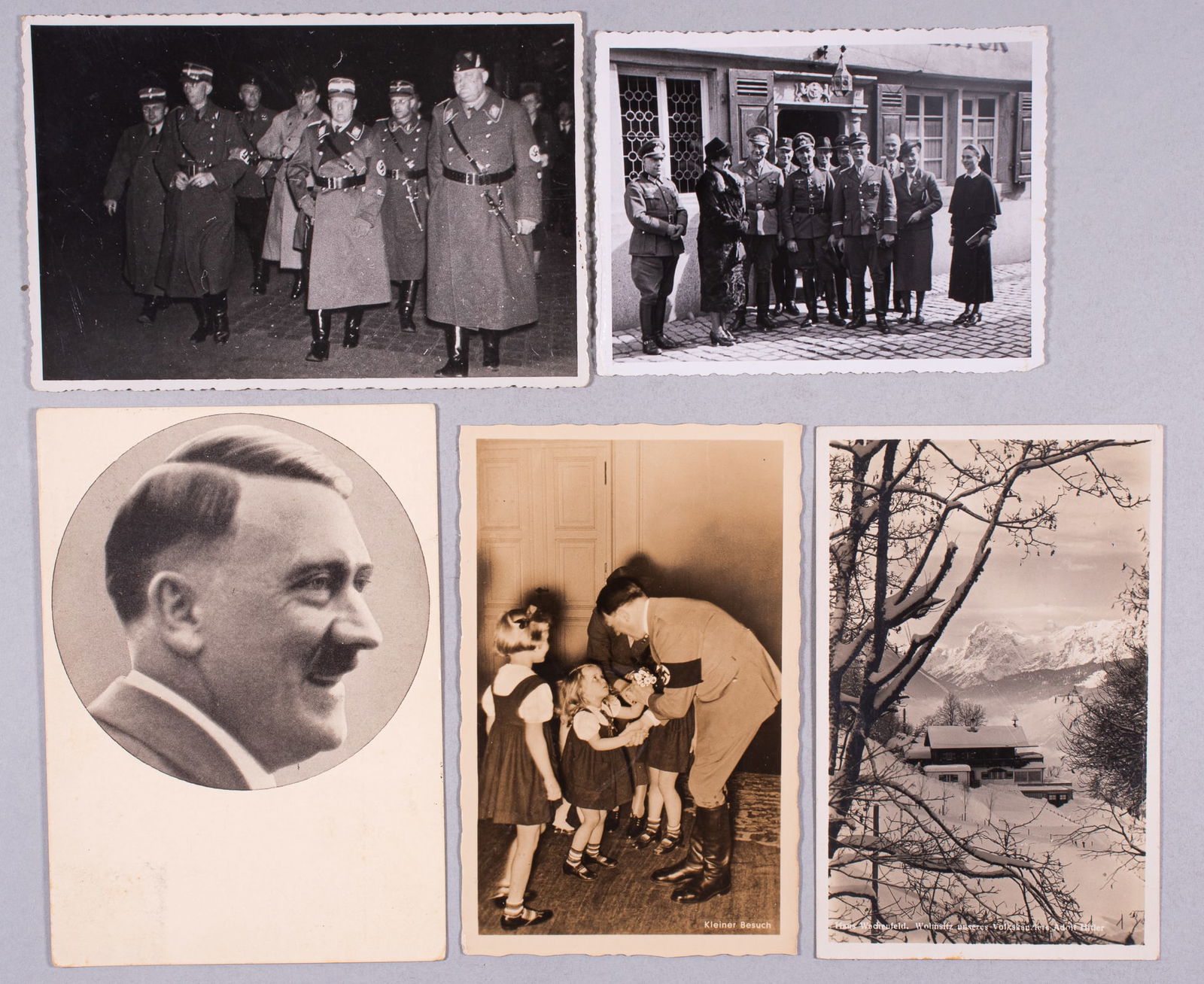 5 WWII GERMAN PHOTOS & POSTCARDS - HITLER, BERGHOF, HUHNLEIN: Five pieces, including a Hoffmann postcard of Hitler, Hitler meeting with girls, the Berghof covered in snow, a b/w photograph of Adolf Huhnlein of the NSKK, and a group b/w photograph of German offic
