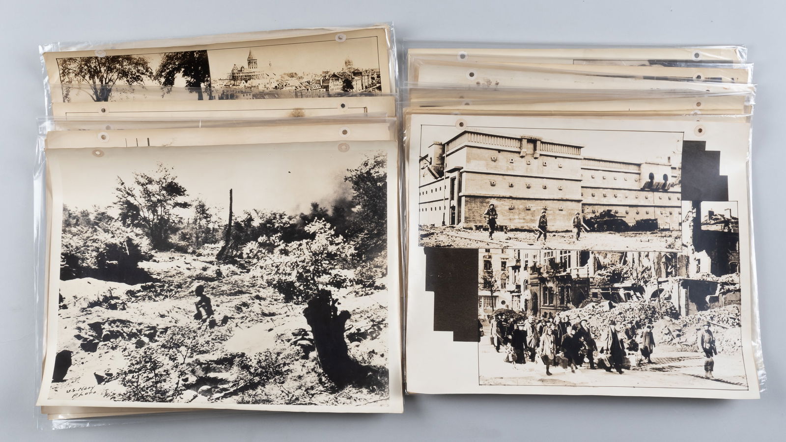 21 WWII US PROPAGANDA PHOTO POSTERS: Twenty-one WWII US propaganda photo posters, most with a caption on the reverse relating to the photo, some include 'As Russians Press Closer to Berlin,' 'Tragic Circus Fire Brings Death and