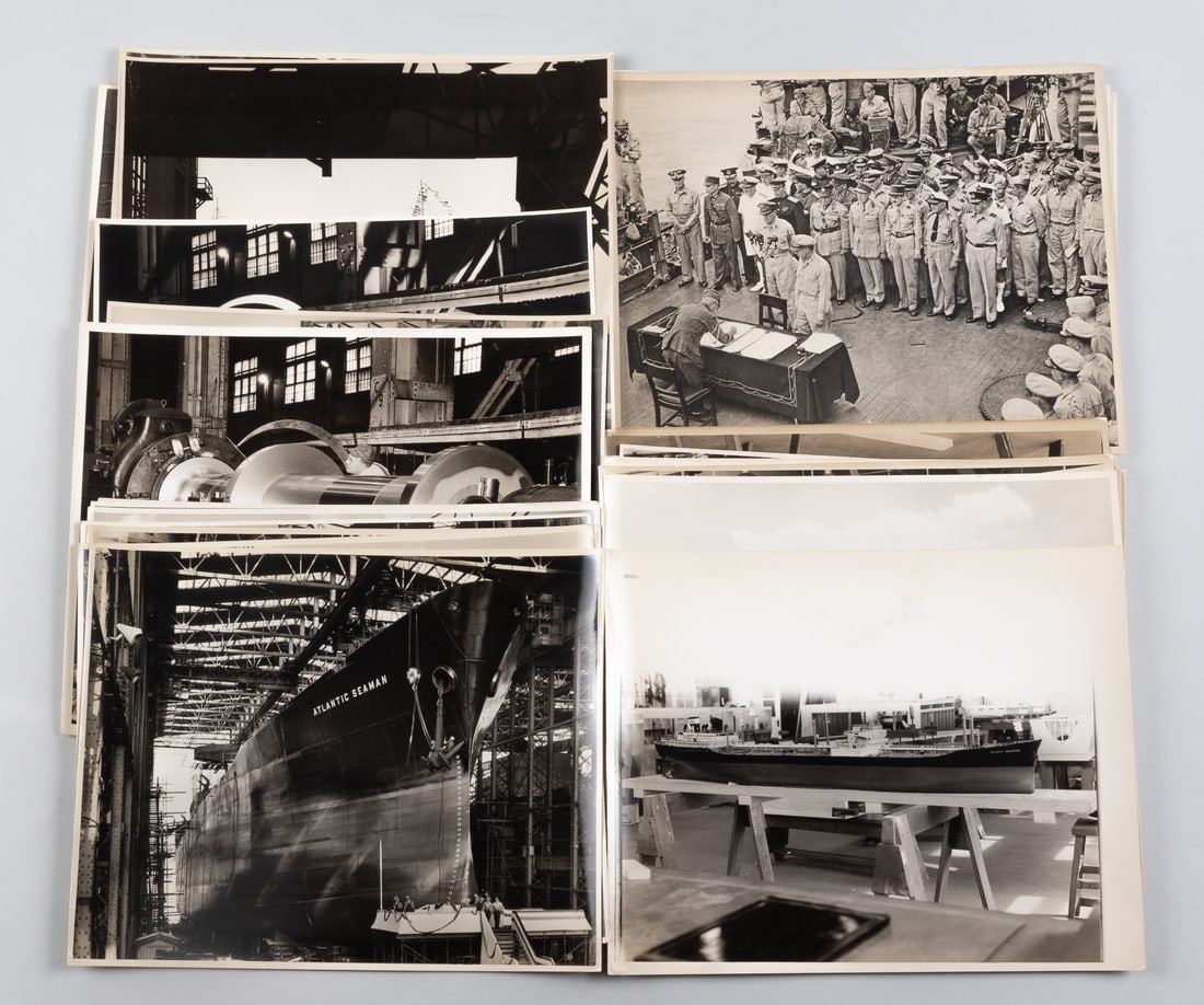 35 WWII SHIPYARD PHOTOGRAPHS: Thirty-five b/w WWII Shipyard building photographs, many photos include the inside of the shipyard, aircraft carriers being built, the Atlantic Seaman in port, a model of the Atlantic Navigator, with