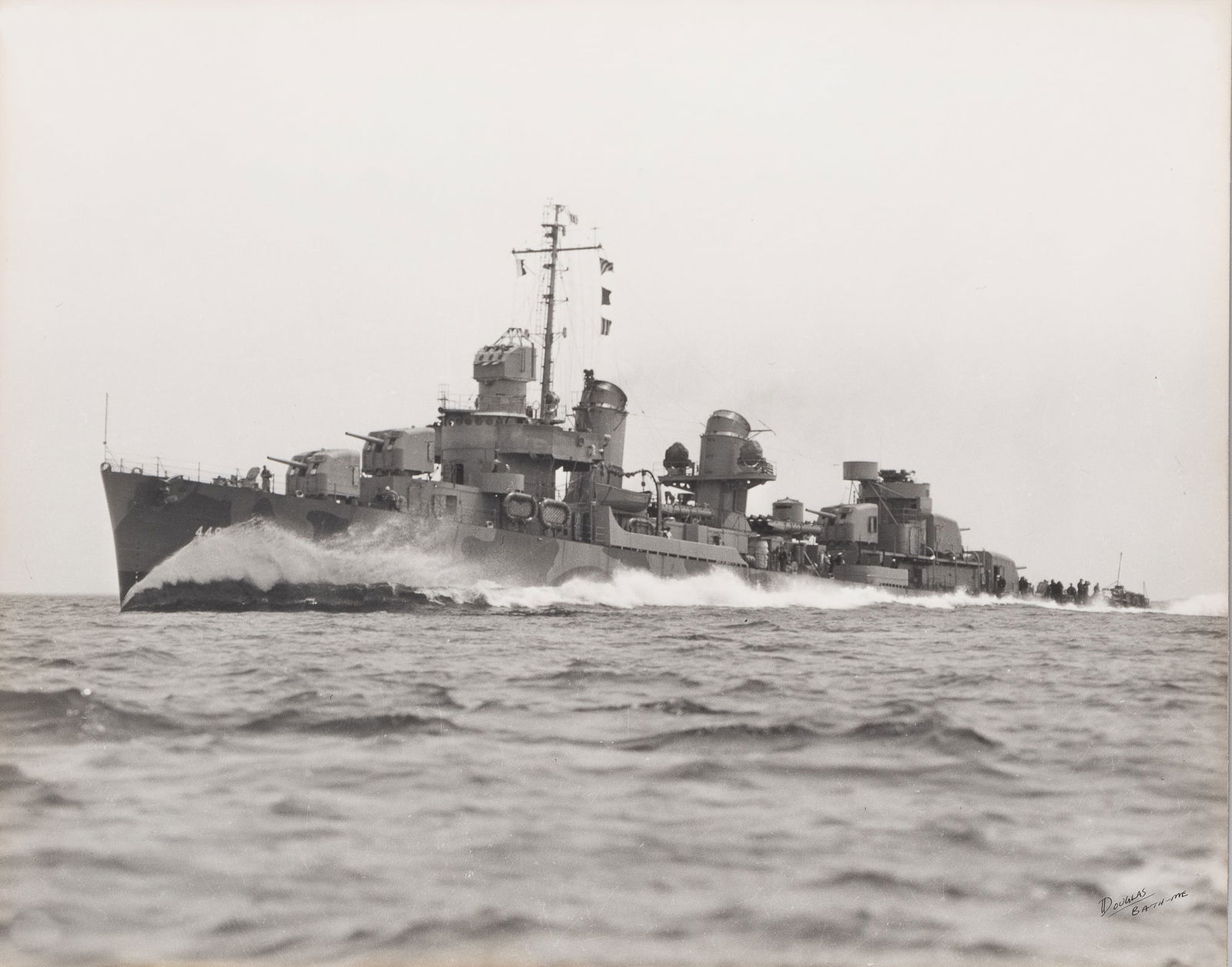 USS NICHOLAS DD-449 ORIGINAL PHOTOGRAPH: Original photograph of the USS Nicholas DD-449, taken by Douglas L. Greene, on the bottom right of the photo is written 'Douglas Bath-Me.' Large fiber-based black and white photograph, 15.5 x 19.5 inc
