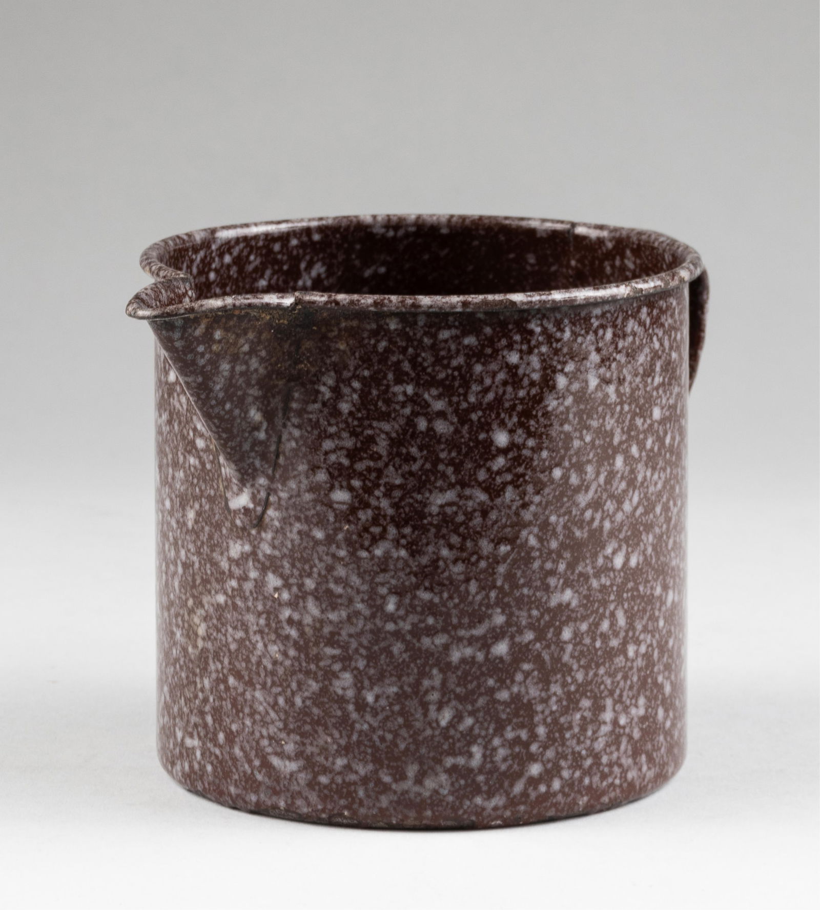 OSKAR SCHINDLER ENAMELED PITCHER: Enameled cup from the Oskar Schindler Emailwarenfabrik in Krakow, Poland. Schindler, through his factories and his now-famous list of 'workers,' saved the lives of 1,100 Jews. Workers in Oskar Schindl